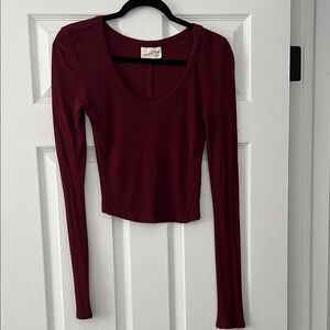 Burgundy Long Sleeve Top cropped to top of pants in length